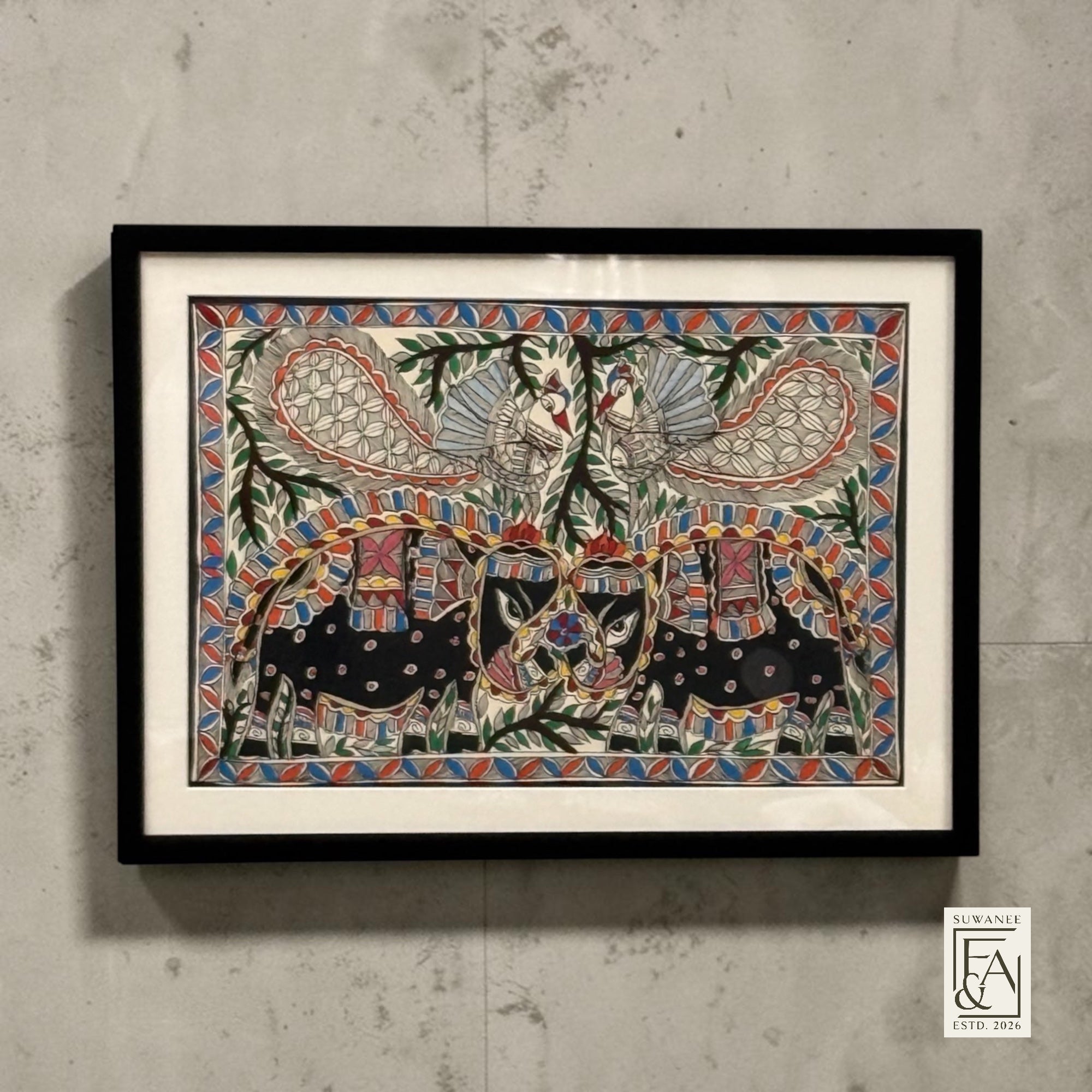 Suwanee Frame & Art framed Madhubani painting of elephants and peacocks with intricate details and vibrant colors on paper.